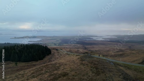 Lateral Linear Aerial of Road on Hill With Lochs in Scotland photo