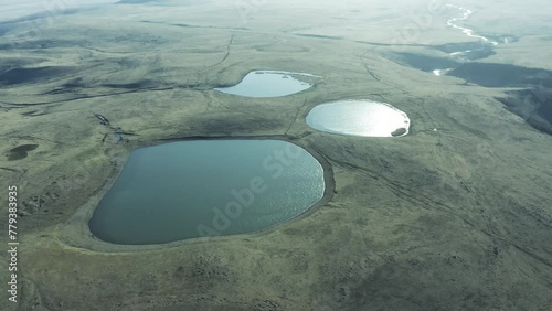 Three Lakes In Town Of Dmanisi In Kvemo Kartli, Georgia. aerial pullback shot photo
