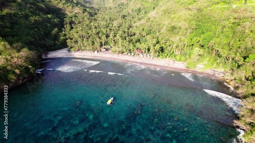 Gamat Bay In Nusa Penida, Bali, Indonesia - Snorkeling Spot With Coconut Palms On Sandy Shoreline. aerial panning shot photo