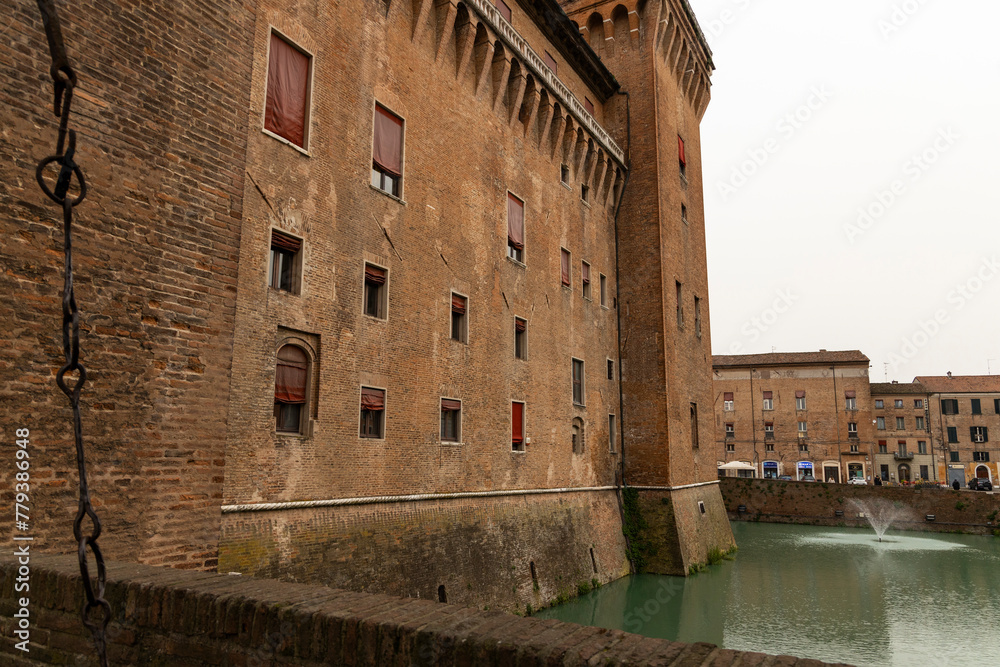 City of Ferrara, historic center, fortifications and castle surrounded by a moat. Squares and buildings in medieval style. Beautiful, unique Italian cities. World cultural heritage. Precious details.
