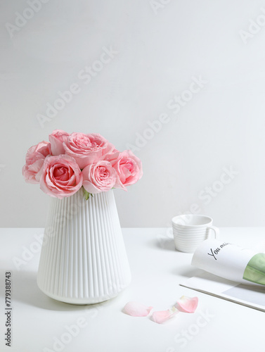 Pink roses for Valentine's Day on a white table top