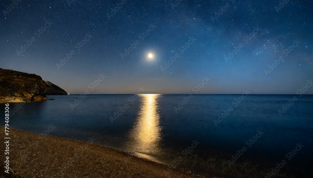 a beautiful night landscape with a clear sky full of stars, a beautiful moon and the ocean beneath it