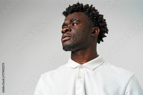 African Man in White Shirt Looking Sideways