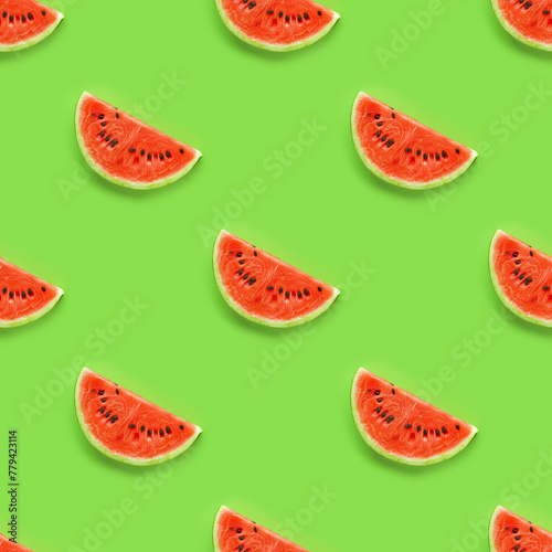 Colorful fruit seamless pattern of fresh watermelon slices on bright green background. Flat lay summer background.