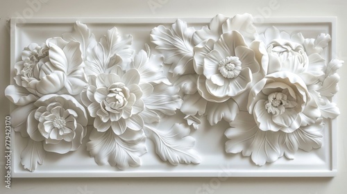 Fototapeta Naklejka Na Ścianę i Meble -  White bas-relief of flowers on framed panel. 3D wall art and floral design concept.
