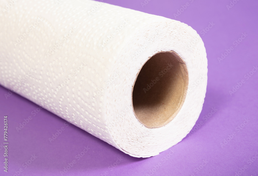 White kitchen paper isolated on purple background White kitchen paper isolated on purple background