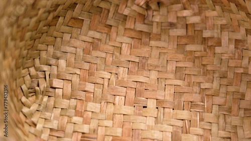 Organic wicker wooden texture of rustic wickerware. Empty rural stylish braided bowl. Rotation photo