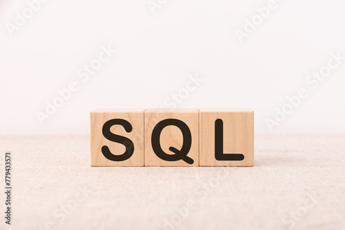 SQL text Structured Query Language on wooden cubes, language concept.
