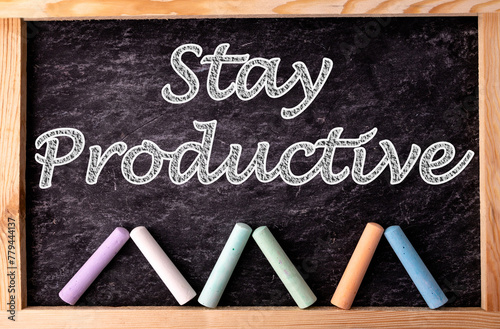 Chalkboard and color chalks with text Stay Productive