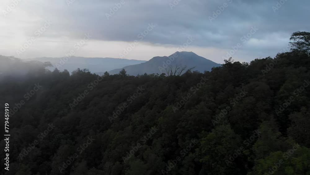 Aerial view of mount Batur in the evening with the evaporation of clouds. Aerial view of mount Batur in the evening with the evaporation of clouds.