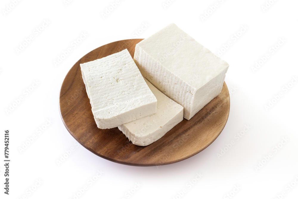 Thinly sliced tofu in a brown wooden plate