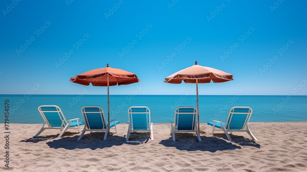 Beach chairs and umbrellas on the sandy beach. Toned.