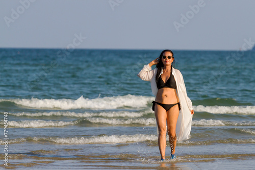 Woman body pretty with black  bikini on beach