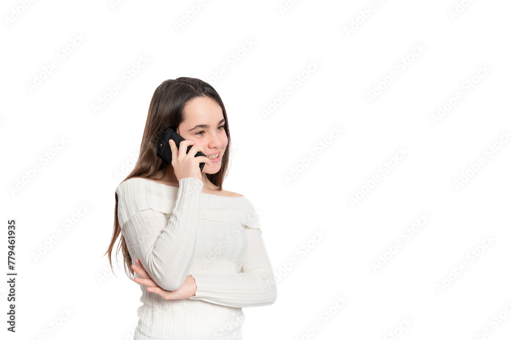 A girl is talking on her cell phone while wearing a white sweater A girl is talking on her cell phone while wearing a white sweater