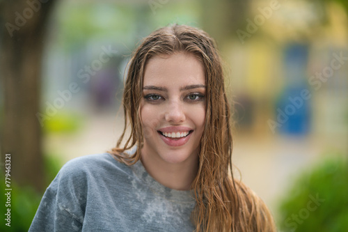 Smiling face. Female face happy portrait. Close up portrait of young happy smiling girl. Young woman smiling with teeth, looking in camera with happy face expression. Smiling female portrait.
