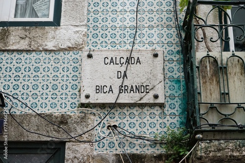 Historic Lisbon street plaque on the walls of a decorated residence in Bairro Alto, Lisbon, Portugal