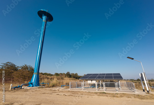 Solar panel for groundwater pump to storage amid drought in rural.