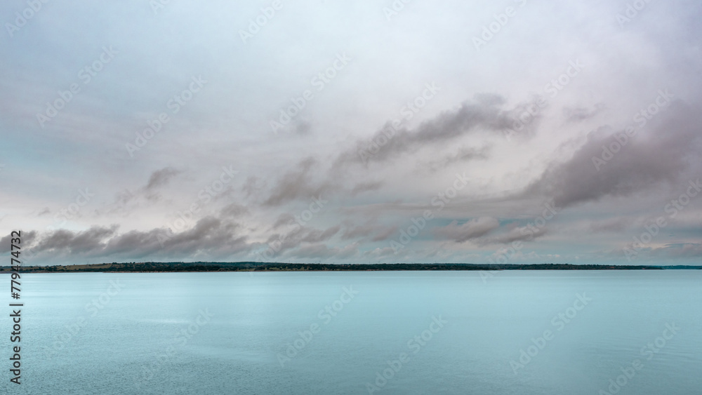 calm water landscape with sky with clouds - obrazy, fototapety, plakaty 