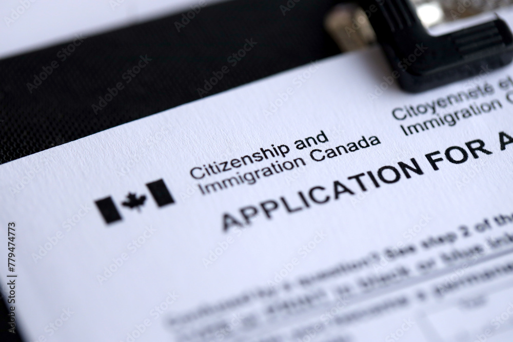 Citizenship and Immigration Canada inscription and small canadian flag close up