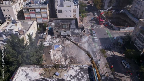 Destruction of buildings by heavy equipment on David Bloch street, Tel Aviv, Israel photo