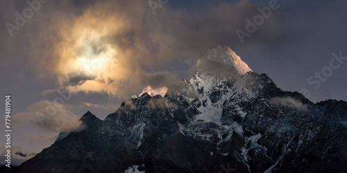 Nepal, Khumbu,Sun setting over Kangtega mountain photo
