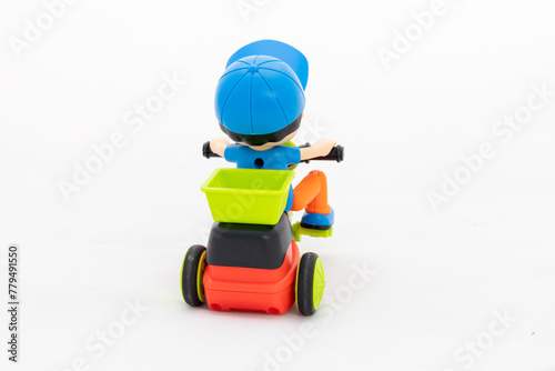 Small cartoon riding tricycle with delivery box on white isolated background