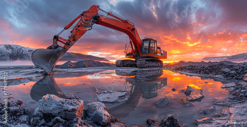 Excavator digging the water at sunset