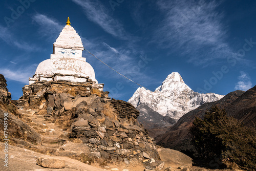 Tibetan Buddshims stupa with Ama Dablam peak near Namche Bazaar in the Himalaya in Nepal photo