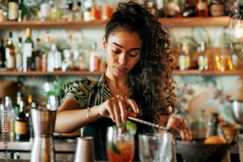 young female bartender worker in restaurant bar preparing cocktail, beautiful young woman behind bar making cocktail