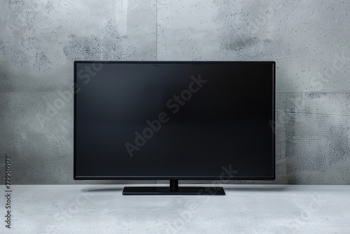 LED TV on Wall. Mockup of Big Blank Flatscreen Television Display Isolated on Black Background photo