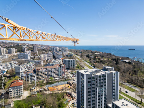 Aerial View of City With Crane © sandsun