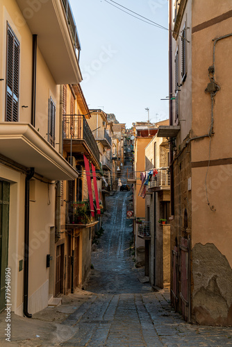 Pietraperzia  Sicily  Italy. Historical city center. Narrow street with houses. Summer sunny day