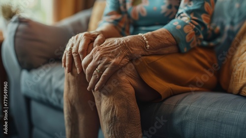A woman's silent struggle with knee arthritis, visibly pained on a sofa, in a powerful close-up