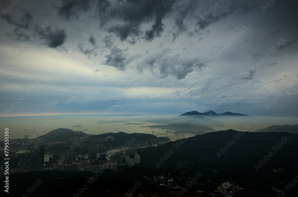 Beautiful view over the city with the sea in the background under the gloomy cloudy sky