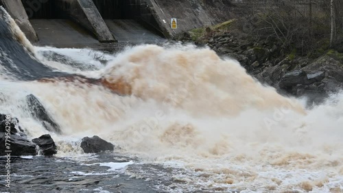 hydroelectric water flowing into the river photo