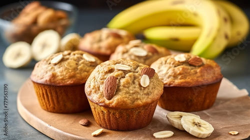Fresh Banana Muffins with Almonds on Wooden Board