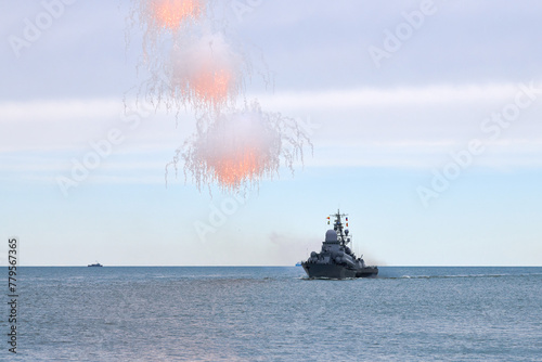 Billede på lærred Russian warship fired decoy flares for self defense, sailing at sea military shi