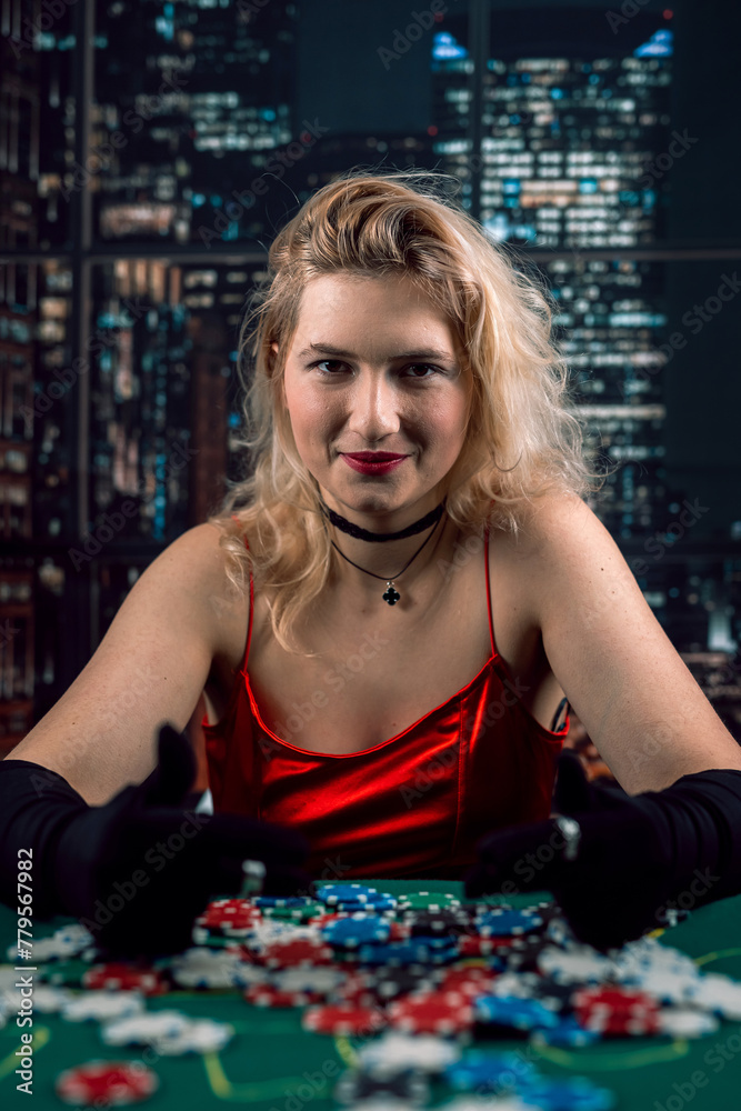 Φωτογραφία Young woman wear red evening dress playing poker at casino