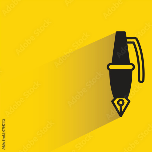 fountain pen icon with shadow on yellow background