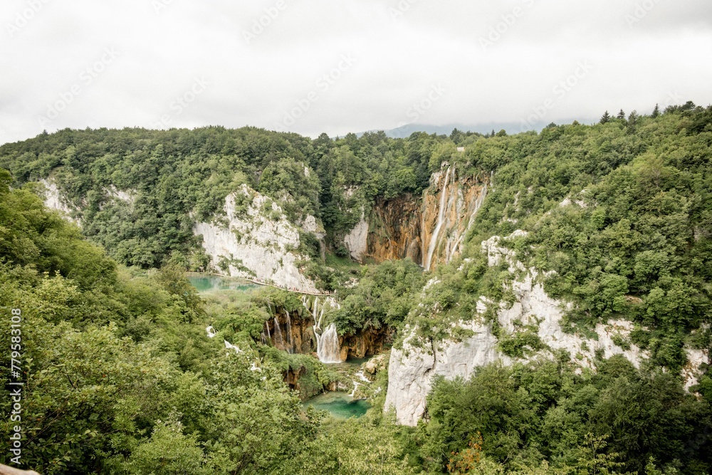 Gorgeous view of the Plitvice Lakes National Park in Croatia with bushy trees and waterfalls