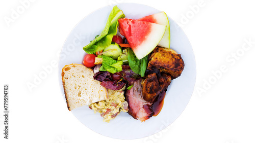 Salad with grilled meat and vegetables on a plate isolated on white background photo