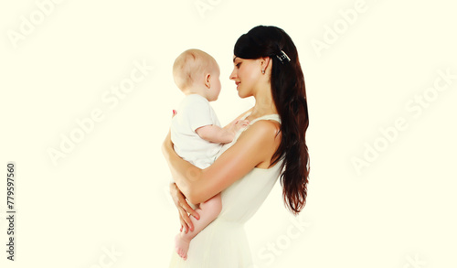 happy young mother holding baby on white studio background