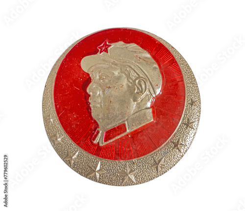 A badge with a portrait of Mao Zedong on a white background