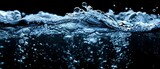 Soda bubbles fizzing underwater against black background resembling an underwater explosion. Concept Underwater Photography, Fizzy Soda Bubbles, Explosion Effect, Black Background