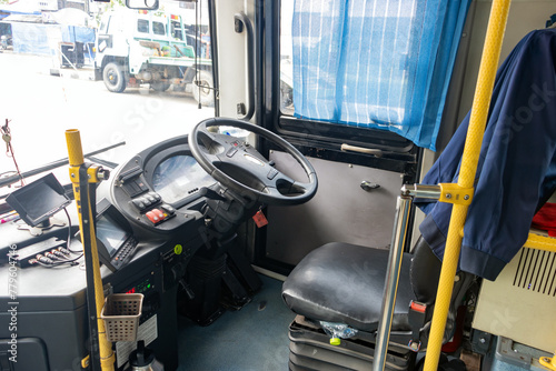 An empty place of bus driver in a public transport bus