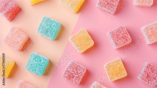 Colorful sugar-coated jelly candies on pastel background