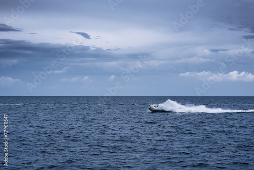 Jet ski racing on a srormy day in the sea