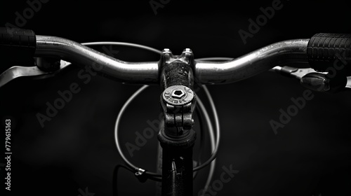 a bicycle handle, black background