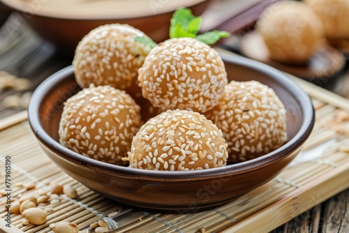 Fried dessert balls filled with different flavored pastes coated with sesame known as Dragon balls a popular Chinese snack