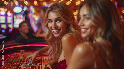 Young, well dressed and rich people playing roulette in the casino.
